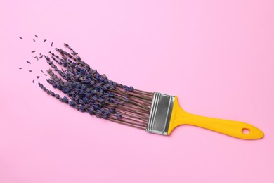 Photo of Creative flat lay composition with paint brush and lavender flowers on pink background