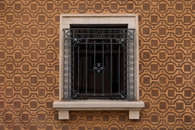Photo of Beautiful window with grills in building outdoors