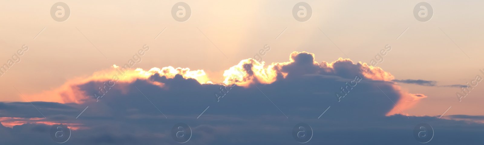 Image of Beautiful cloudy sky at sunset, banner design