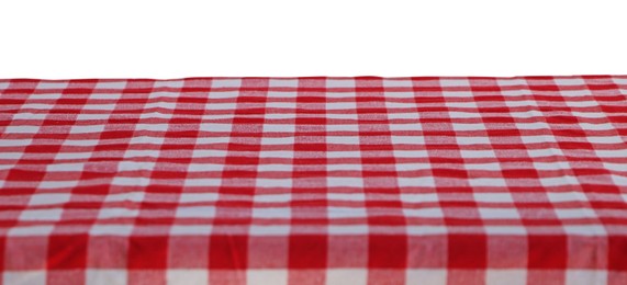 Table with checkered picnic cloth isolated on white