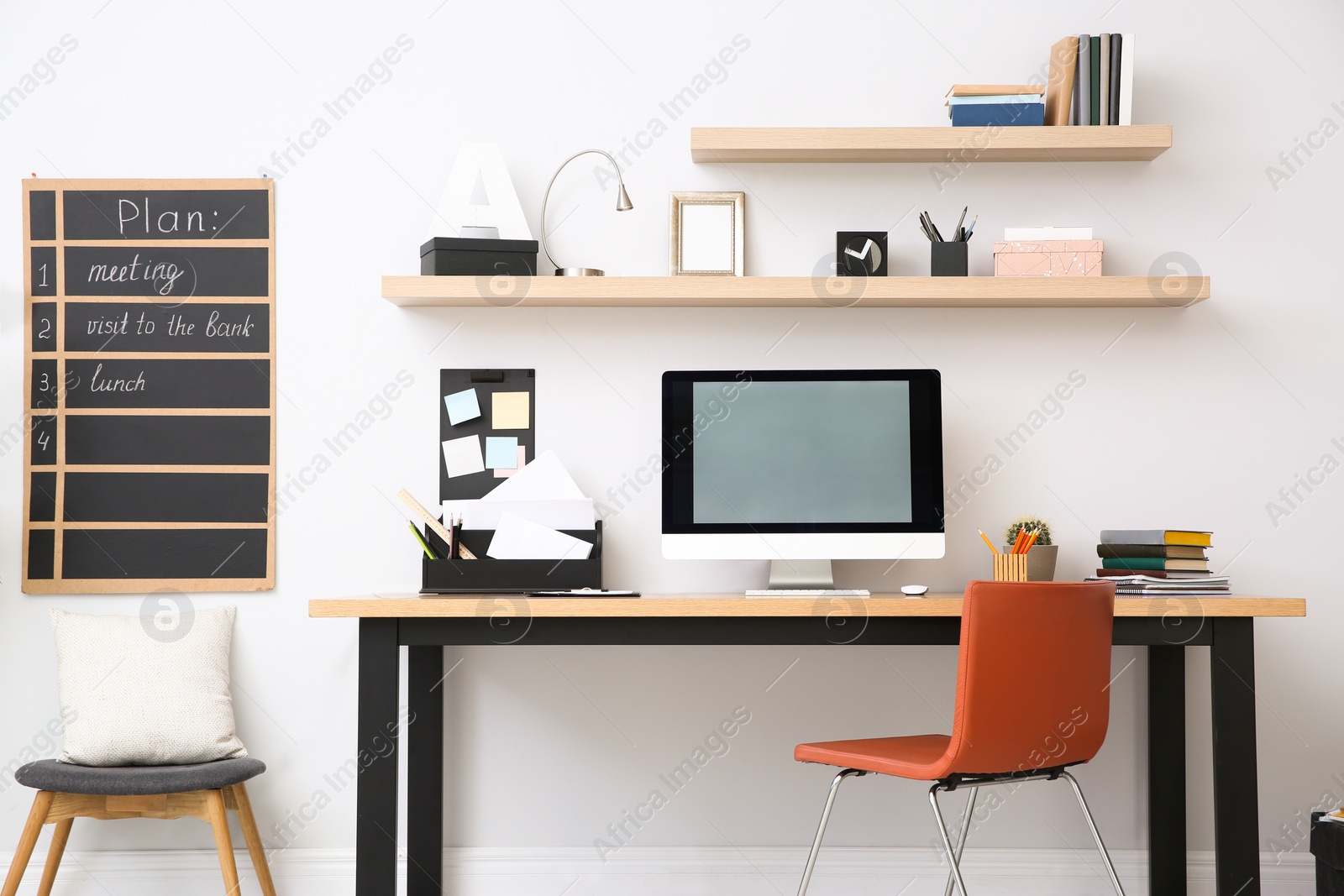 Photo of Modern computer on table in office interior. Stylish workplace