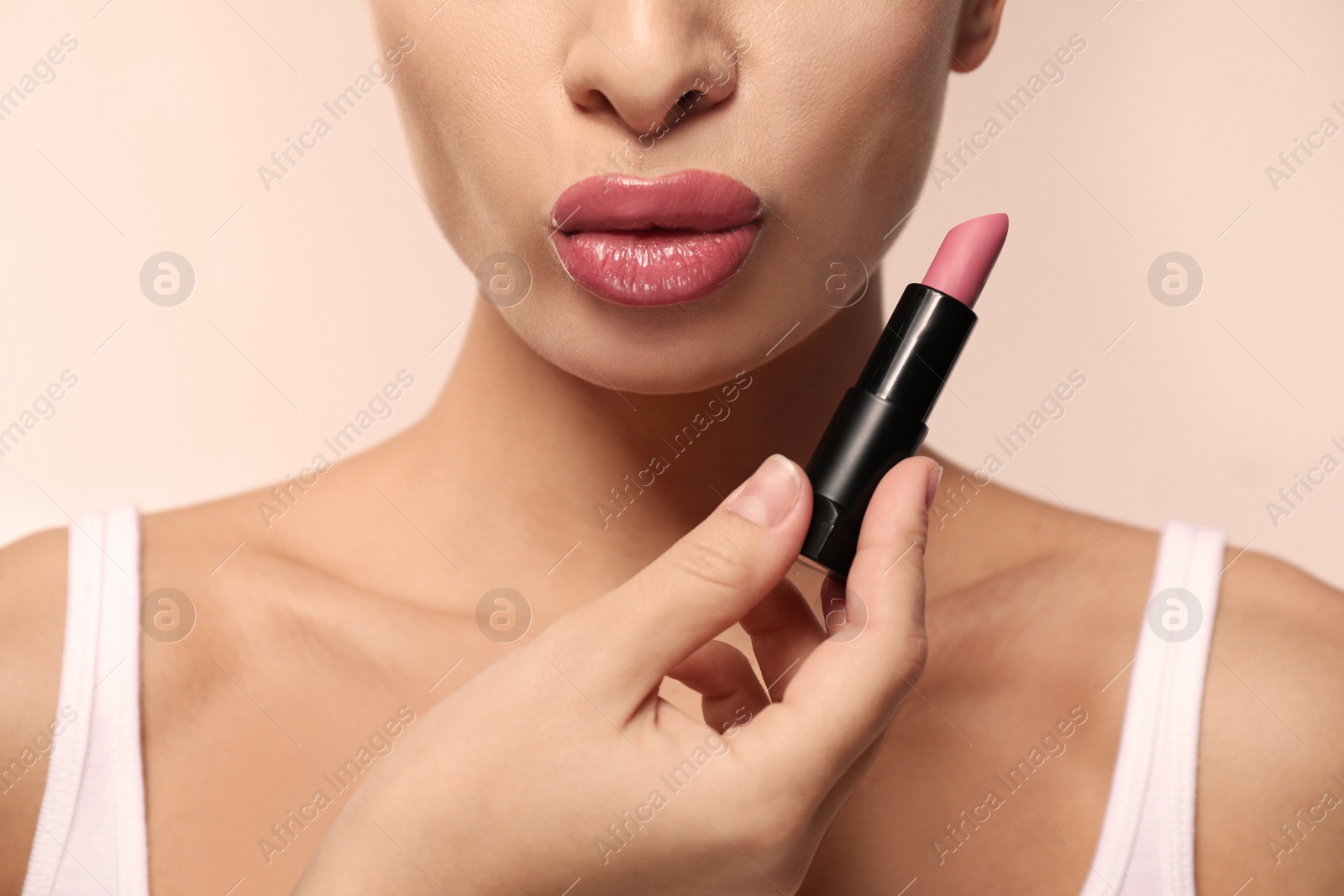 Photo of Woman with pink lipstick on light background, closeup