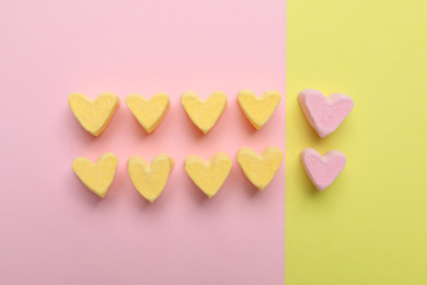 Flat lay composition with marshmallow hearts on color background. Pareto principle concept