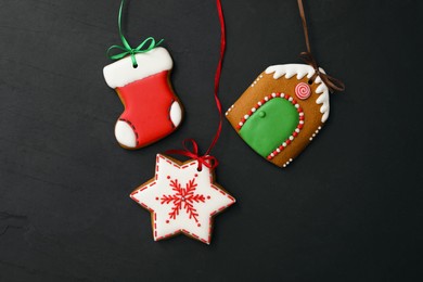 Photo of Different delicious Christmas cookies on black table, flat lay