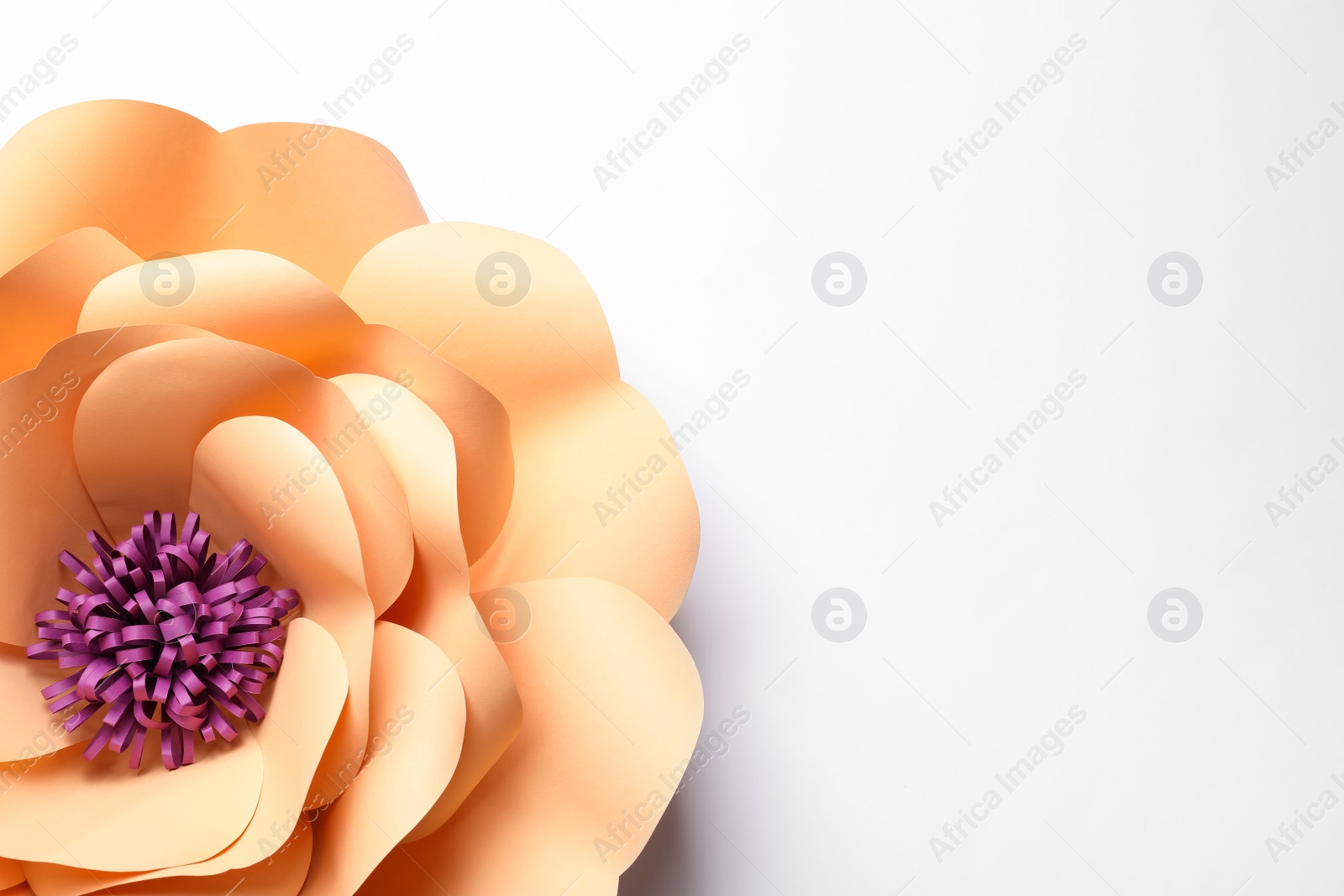 Photo of Beautiful yellow flower made of paper on white background, top view