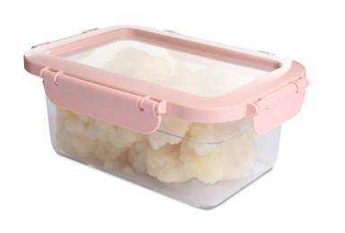 Photo of Frozen cauliflower florets in plastic container isolated on white. Vegetable preservation