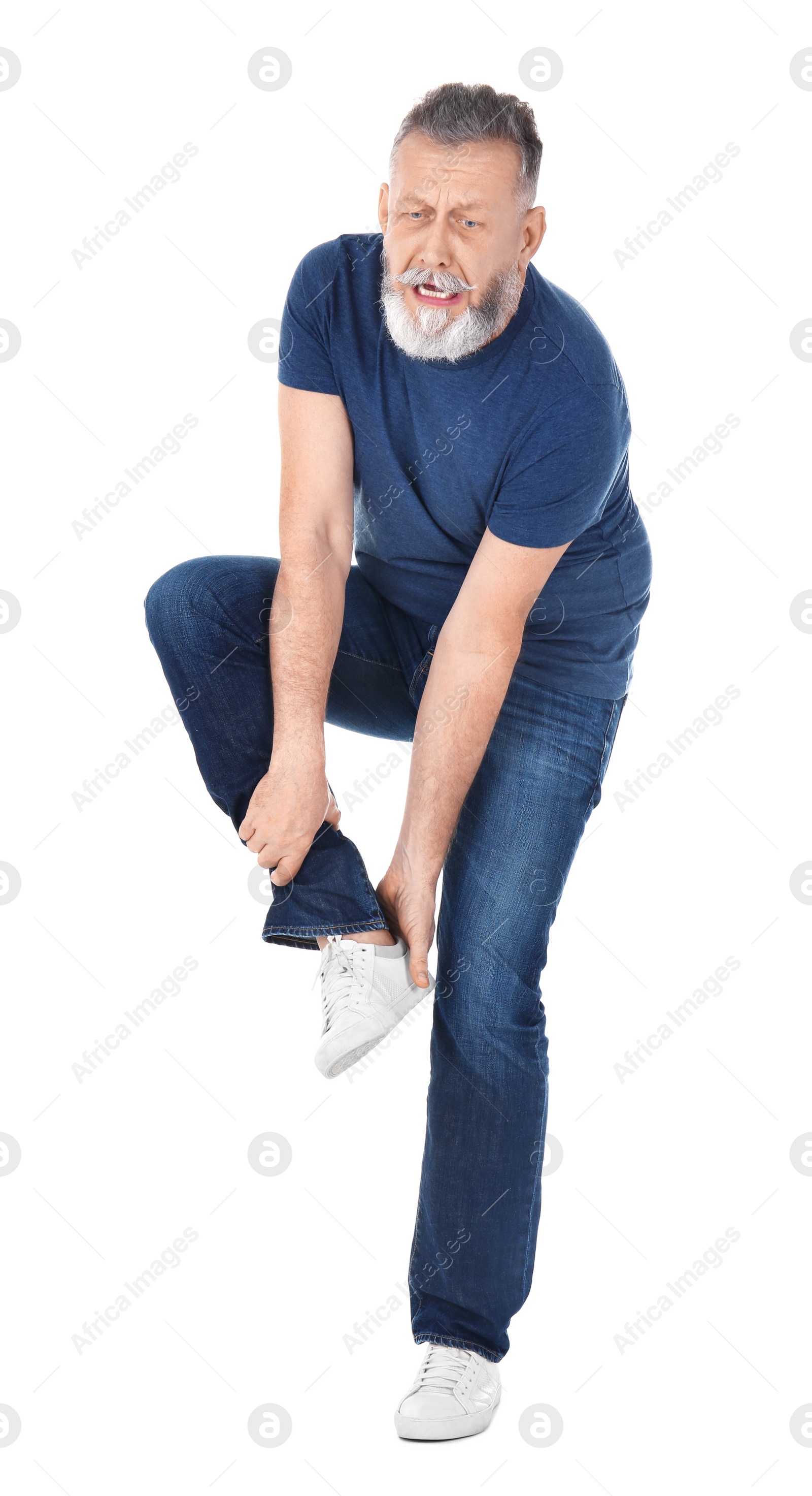 Photo of Man suffering from leg pain on white background