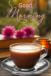 Good morning! Glass cup with coffee on wooden table