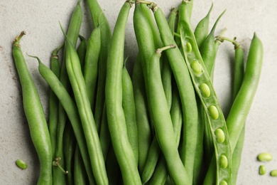 Fresh green beans on light grey table, flat lay