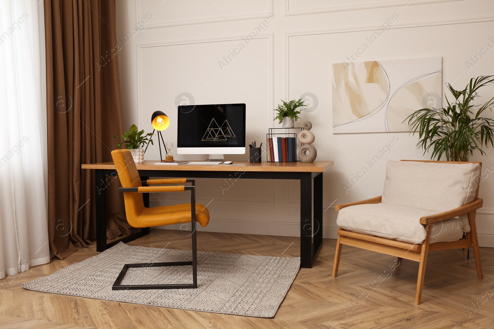 Photo of Room interior with comfortable workplace. Modern computer on wooden desk