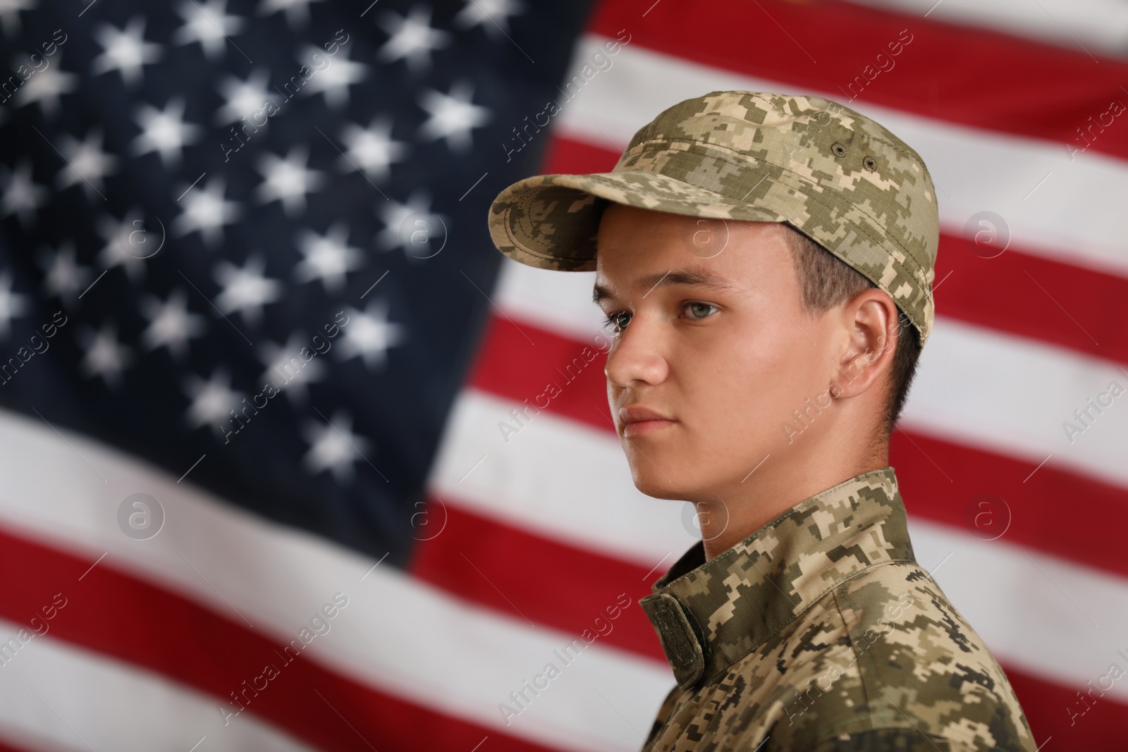 Photo of Male soldier in uniform against USA flag
