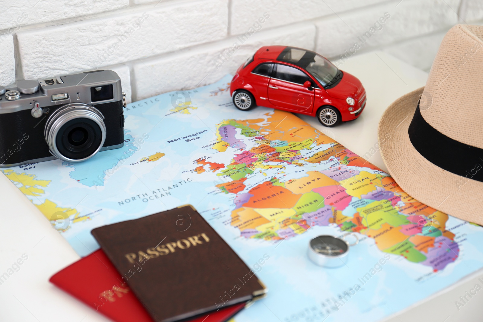 Photo of Composition with world map and different items on table. Trip planning