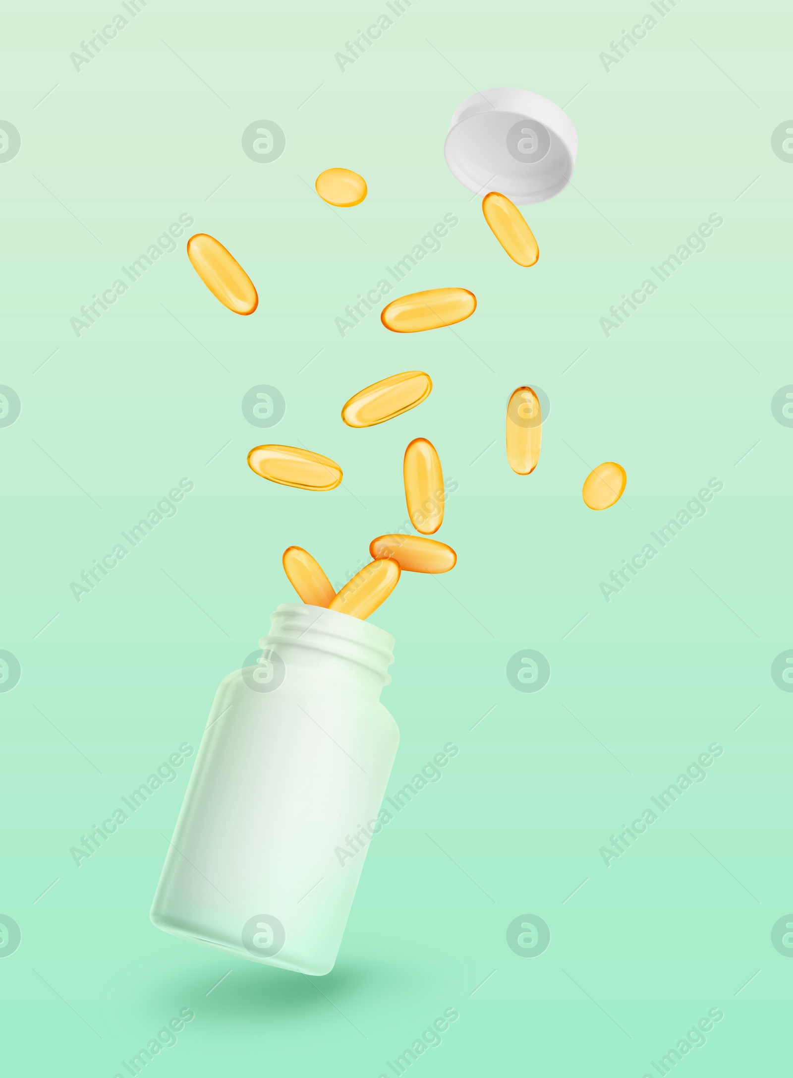 Image of Vitamin. Softgel capsules and bottle in air against green background