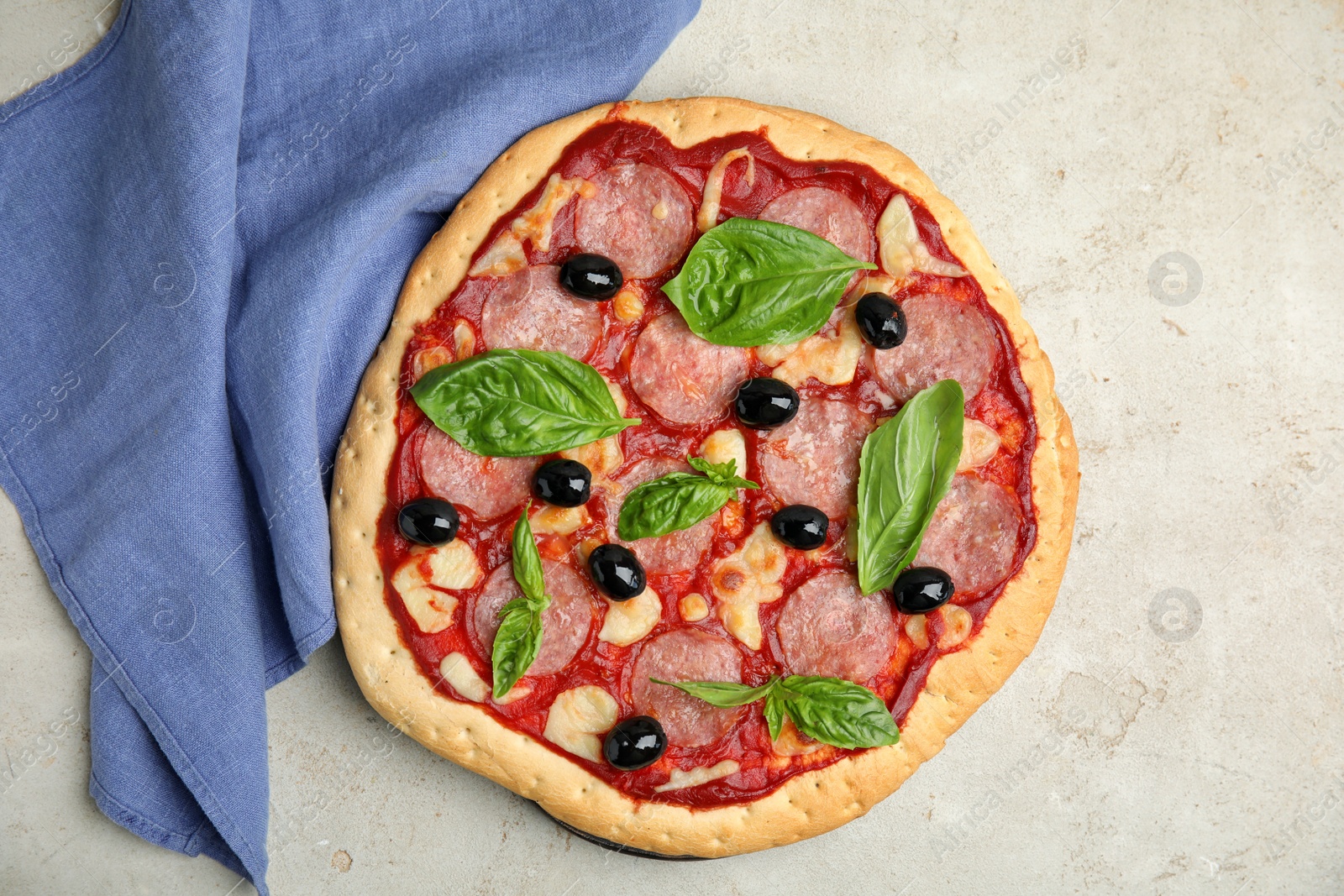 Photo of Delicious homemade pita pizza on light table, flat lay