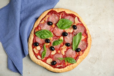 Delicious homemade pita pizza on light table, flat lay