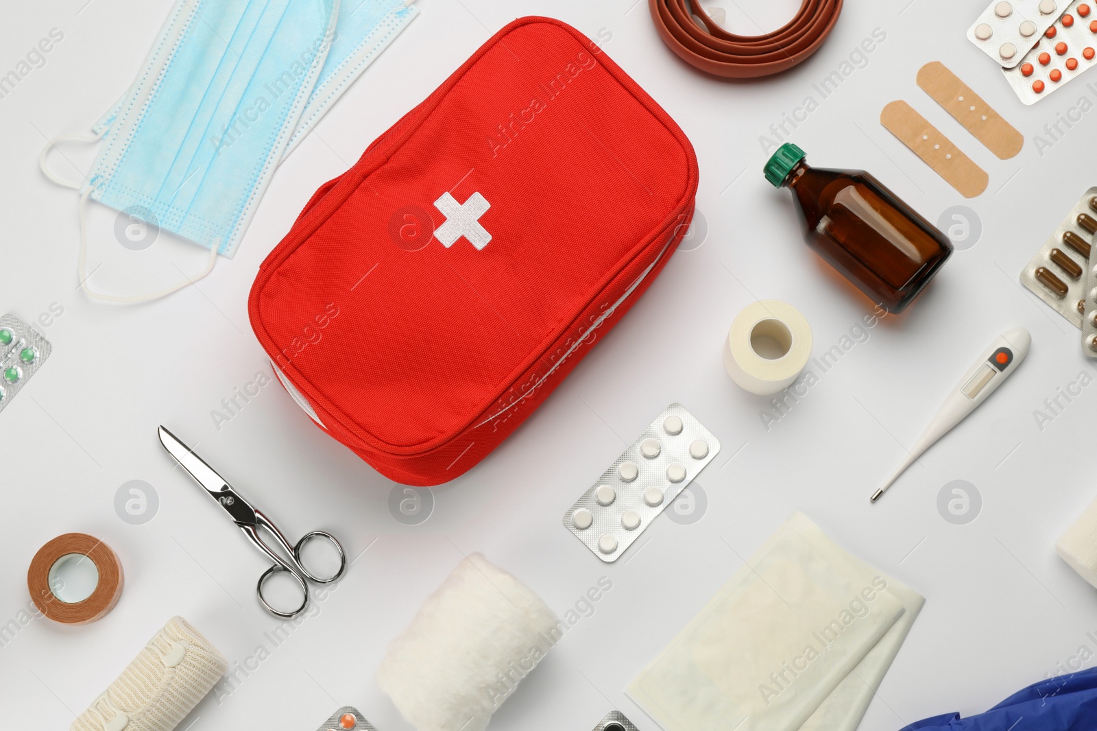 Photo of Flat lay composition with first aid kit on white background