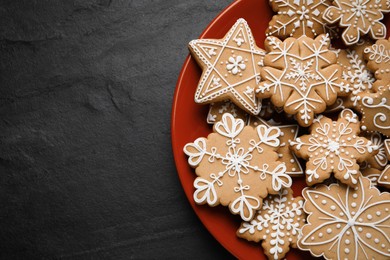 Tasty Christmas cookies on black table, top view. Space for text
