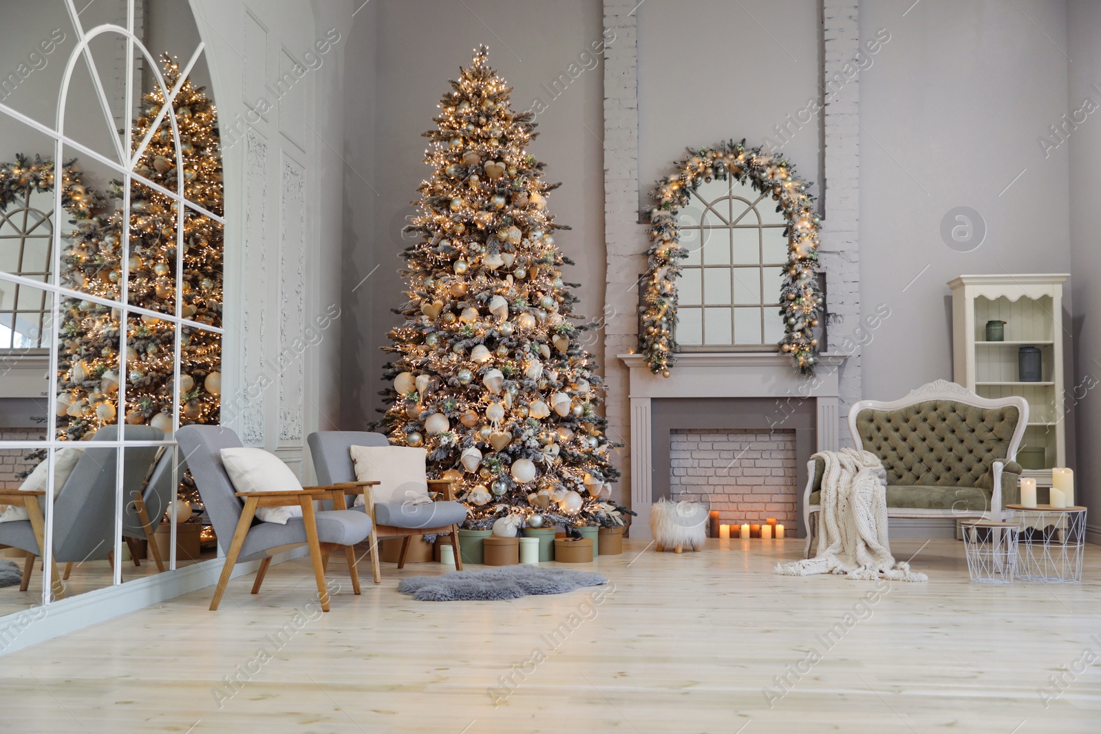 Photo of Festive room interior with stylish furniture and beautiful Christmas tree