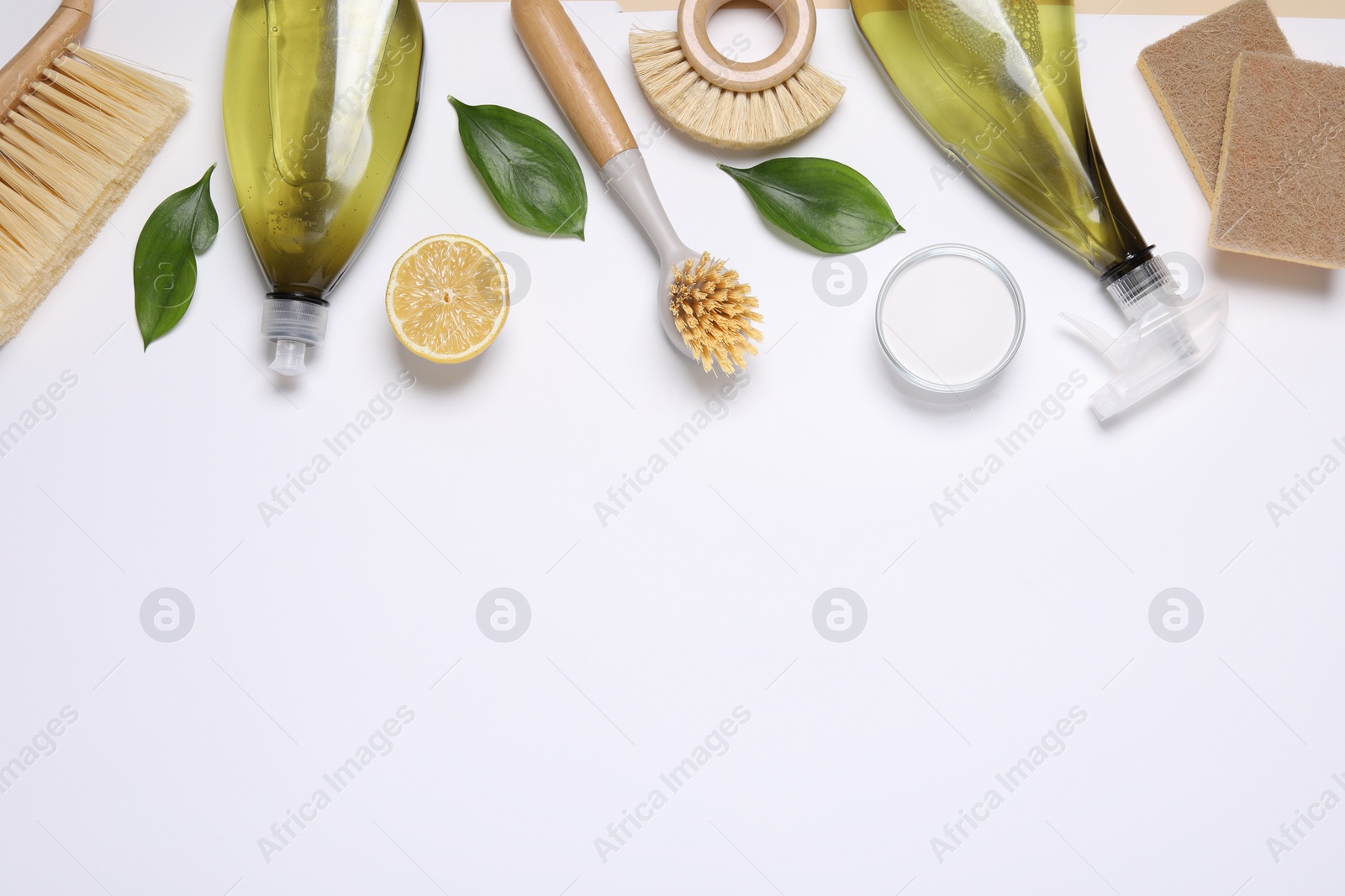 Photo of Flat lay composition with different cleaning supplies on white background