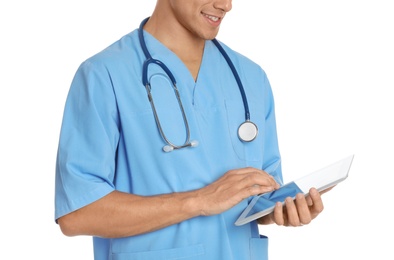 Photo of Male doctor with stethoscope and tablet PC on white background, closeup. Medical object