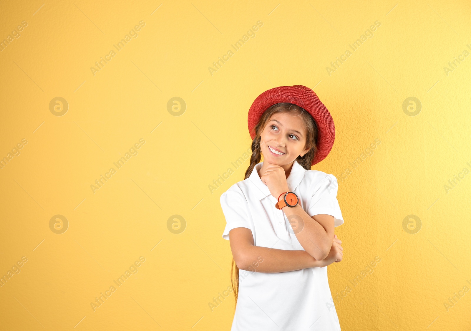 Photo of Pretty preteen girl posing against color background. Space for text