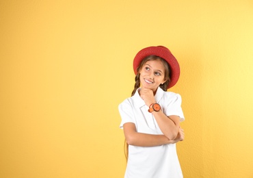 Pretty preteen girl posing against color background. Space for text