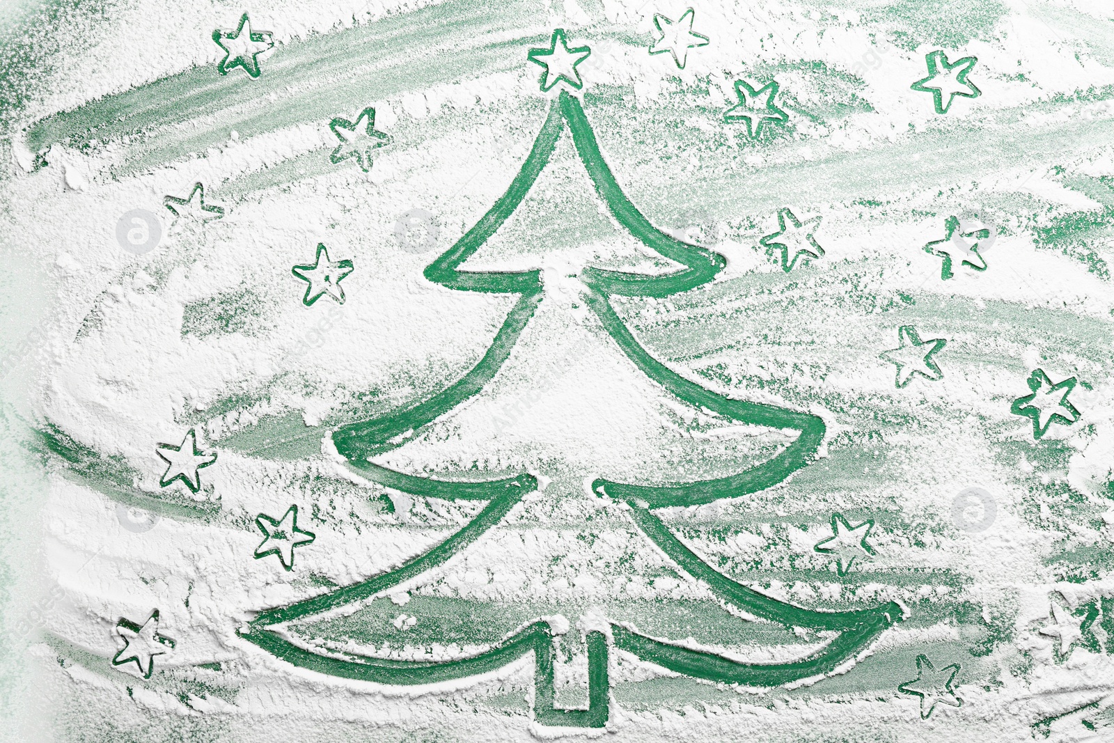 Photo of Christmas tree and stars made of flour on green background, top view