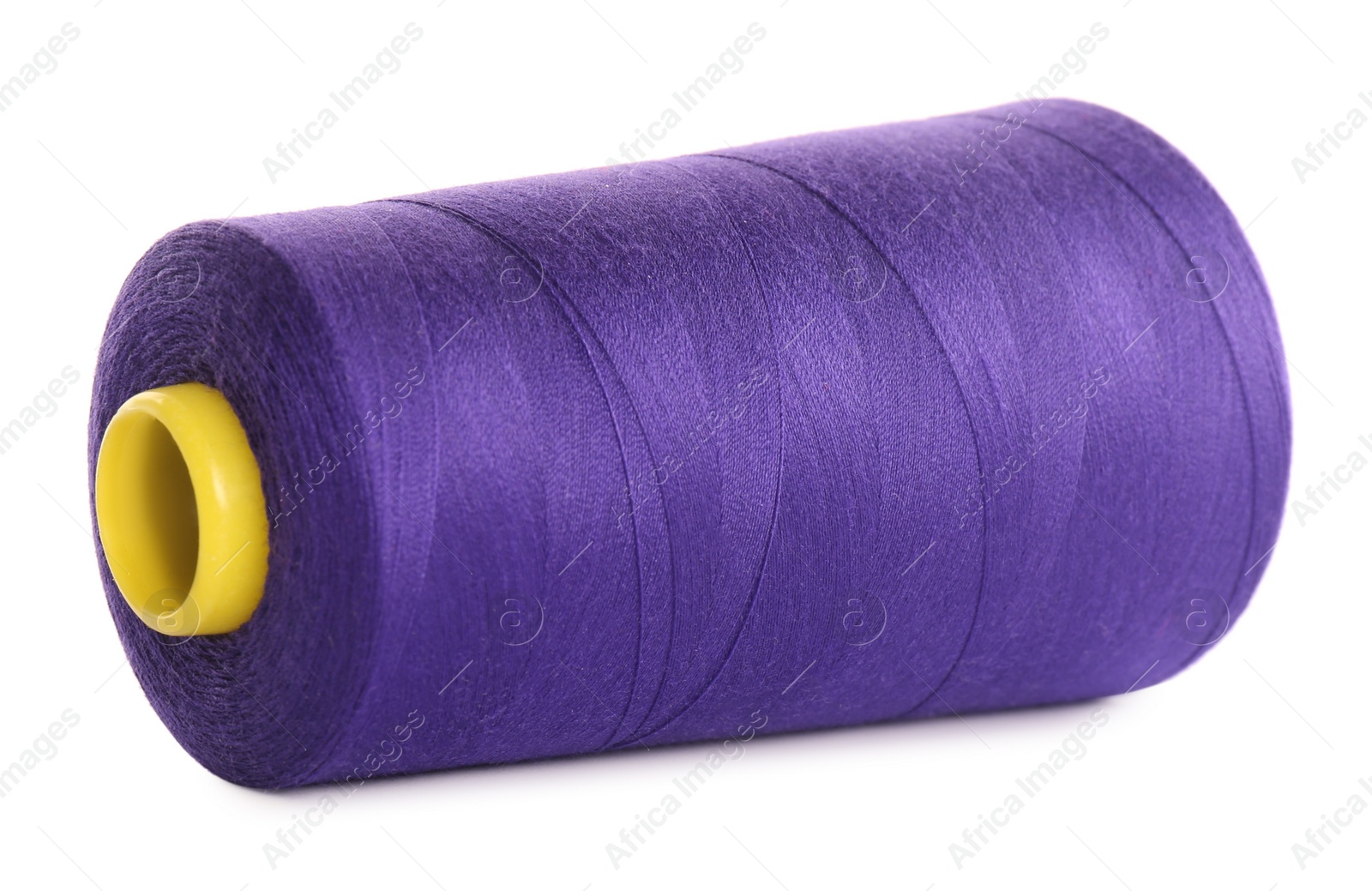 Photo of Spool of purple sewing thread isolated on white