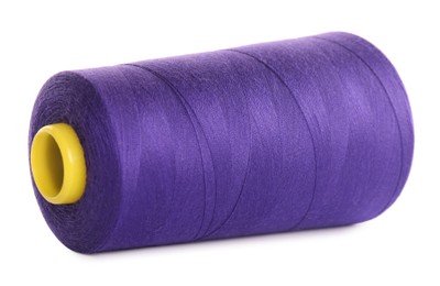 Spool of purple sewing thread isolated on white