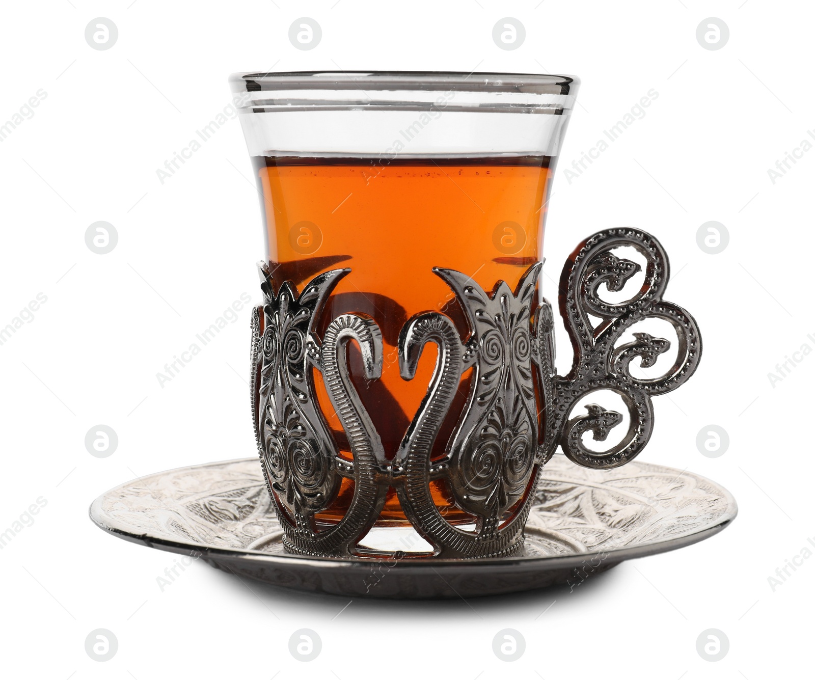 Photo of Glass of traditional Turkish tea in vintage holder isolated on white