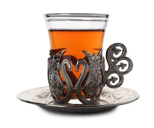 Glass of traditional Turkish tea in vintage holder isolated on white