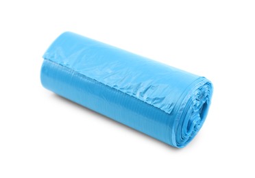 Photo of Roll of light blue garbage bags isolated on white