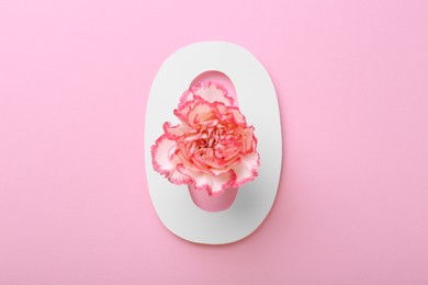 Paper number 0 and beautiful carnation flower on pink background, top view