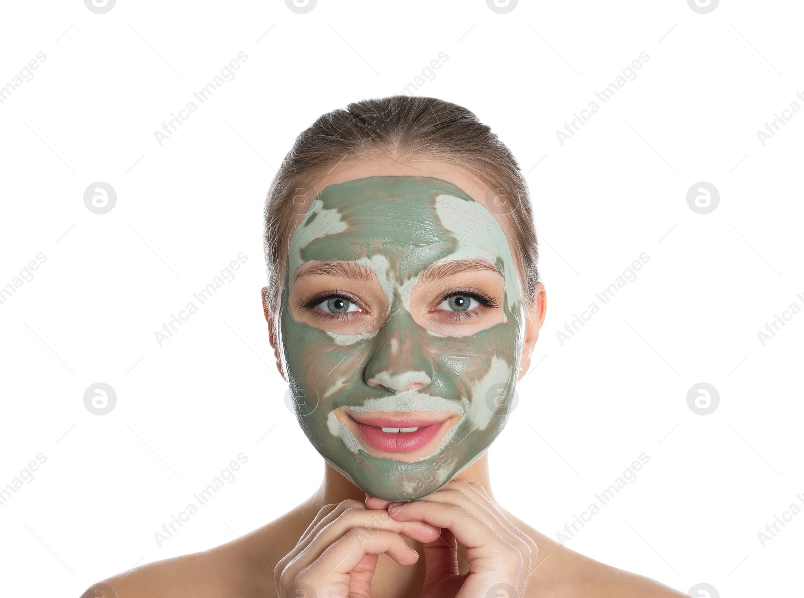 Photo of Beautiful woman with clay mask on her face against white background