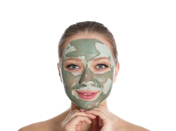 Beautiful woman with clay mask on her face against white background