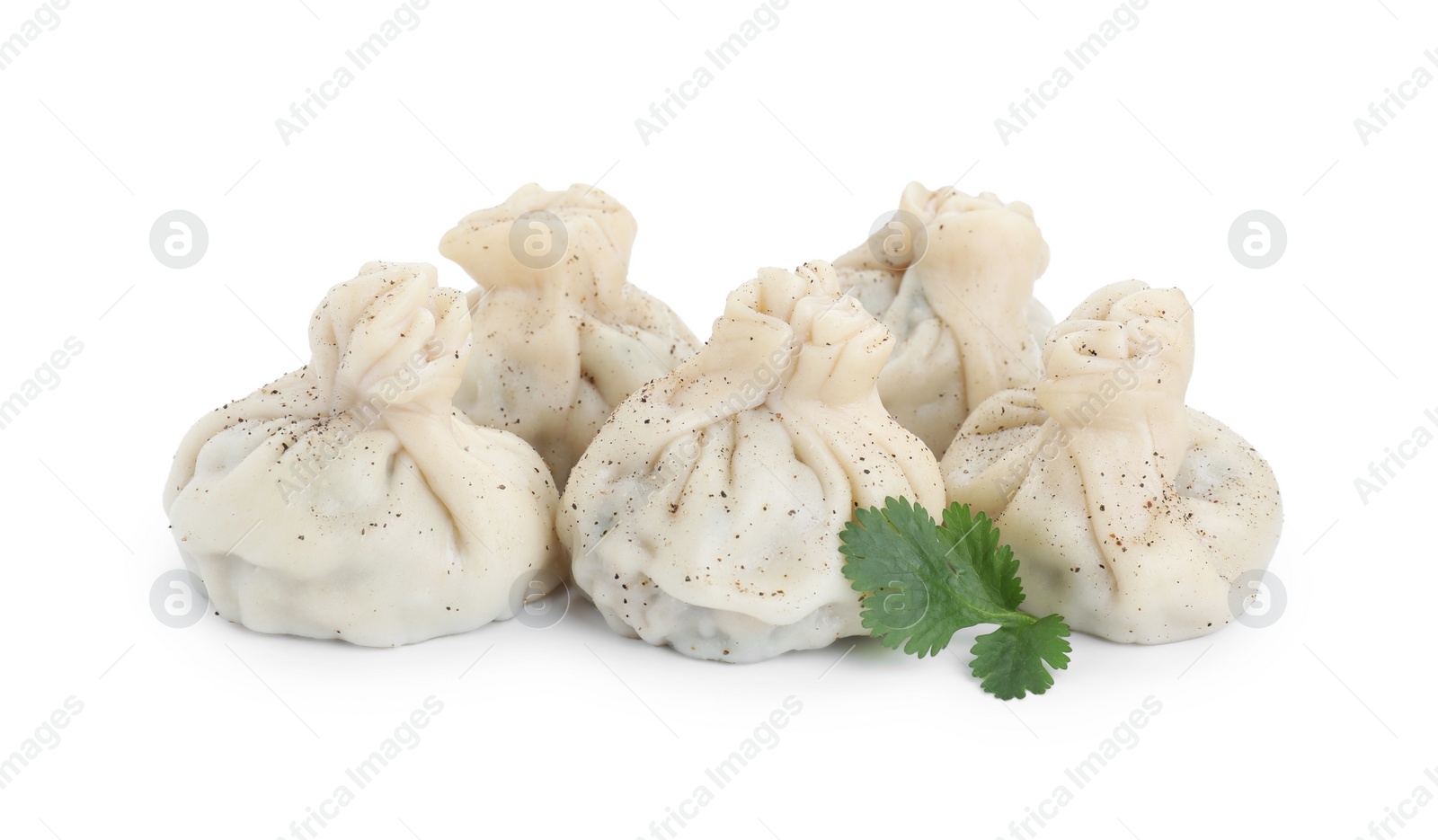 Photo of Tasty khinkali (dumplings) and spices isolated on white. Georgian cuisine