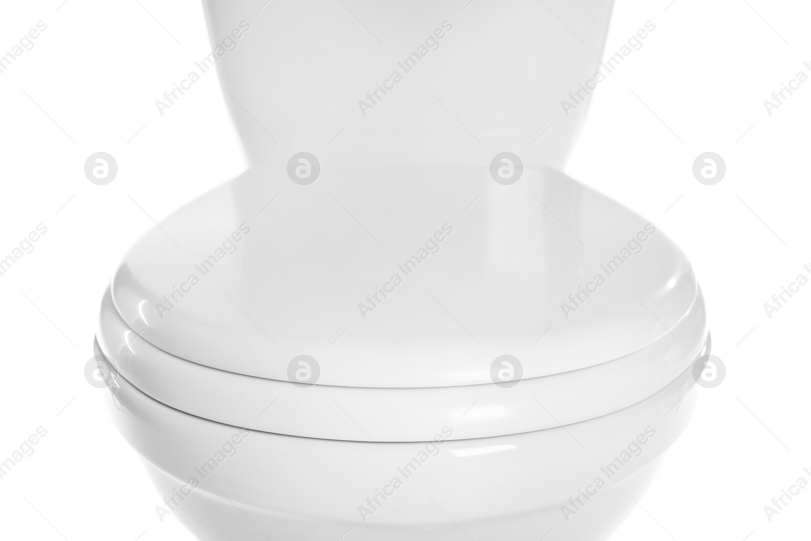 Photo of New ceramic toilet bowl on white background, closeup