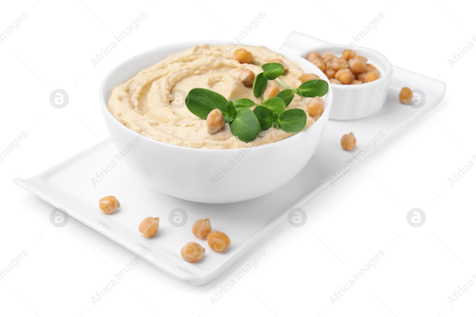 Photo of Bowl of delicious hummus with chickpeas isolated on white