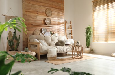 Photo of Living room interior with stylish decor and comfortable sofa