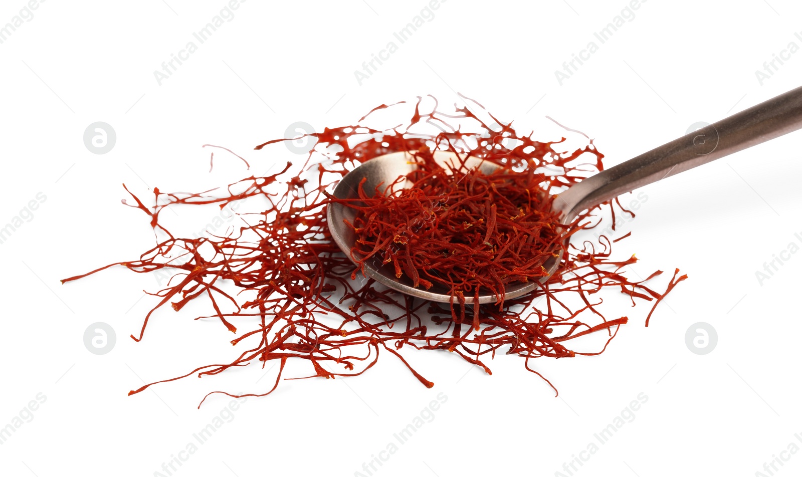 Photo of Spoon of dried red saffron isolated on white