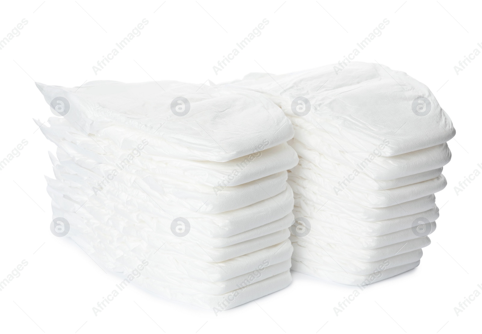 Photo of Stacks of baby diapers isolated on white