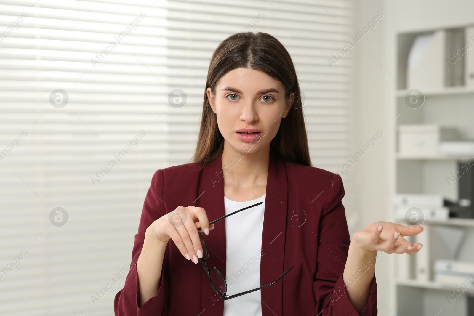 Photo of Young woman having online video call at home, view from web camera