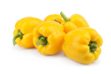 Photo of Ripe yellow bell peppers isolated on white