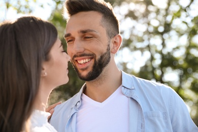 Photo of Lovely young couple dancing together in park on sunny day