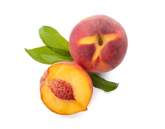 Photo of Whole and cut ripe peaches with leaves isolated on white, top view