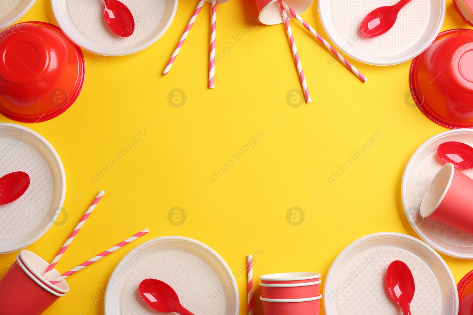 Photo of New plastic dishware and space for text on color background. Table setting