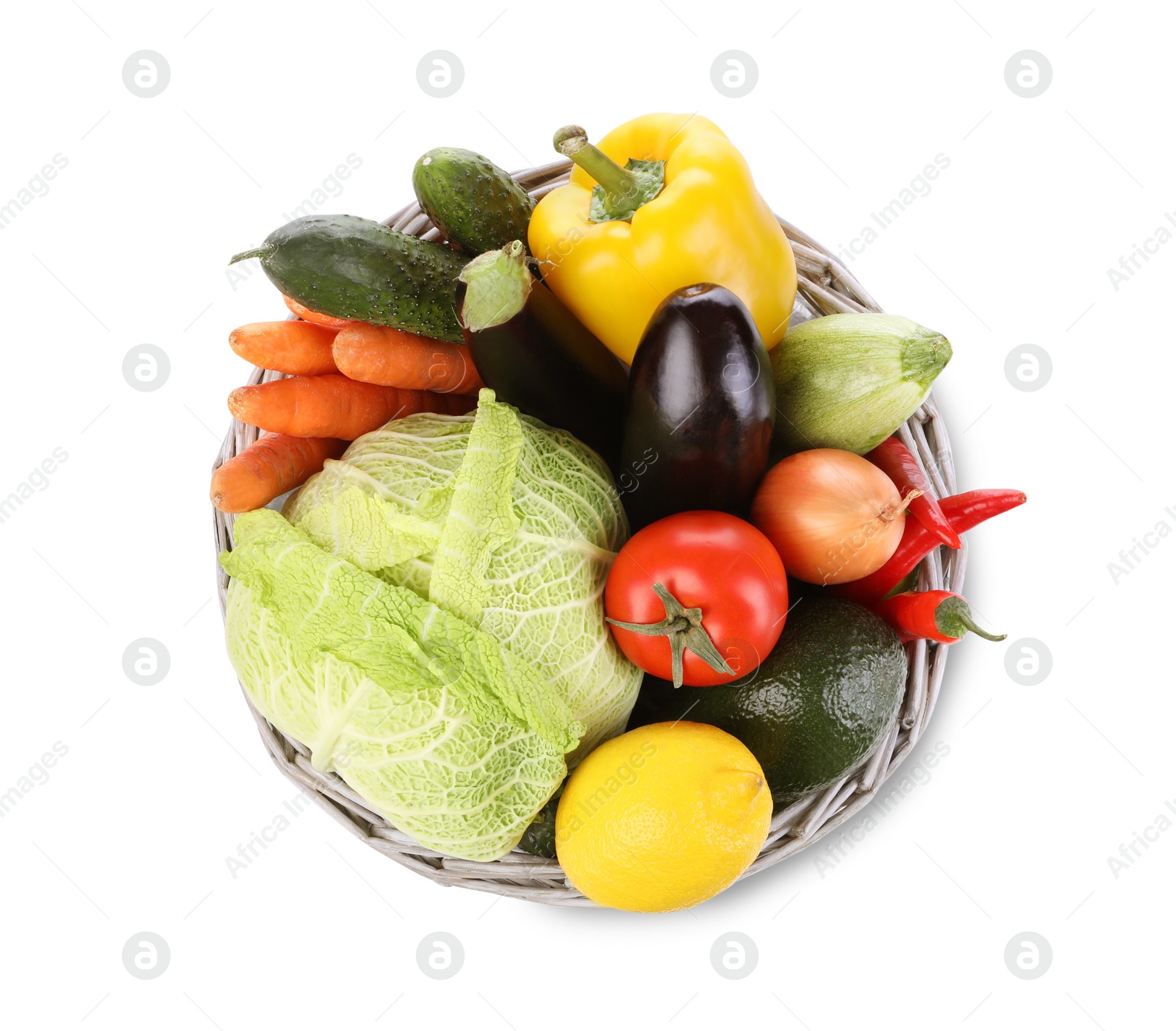 Photo of Wicker basket with fresh ripe vegetables and fruit on white background, top view