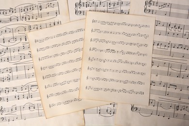 Photo of Sheets of paper with different notes as background, top view