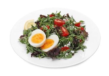 Photo of Delicious salad with boiled egg, arugula and tomatoes isolated on white