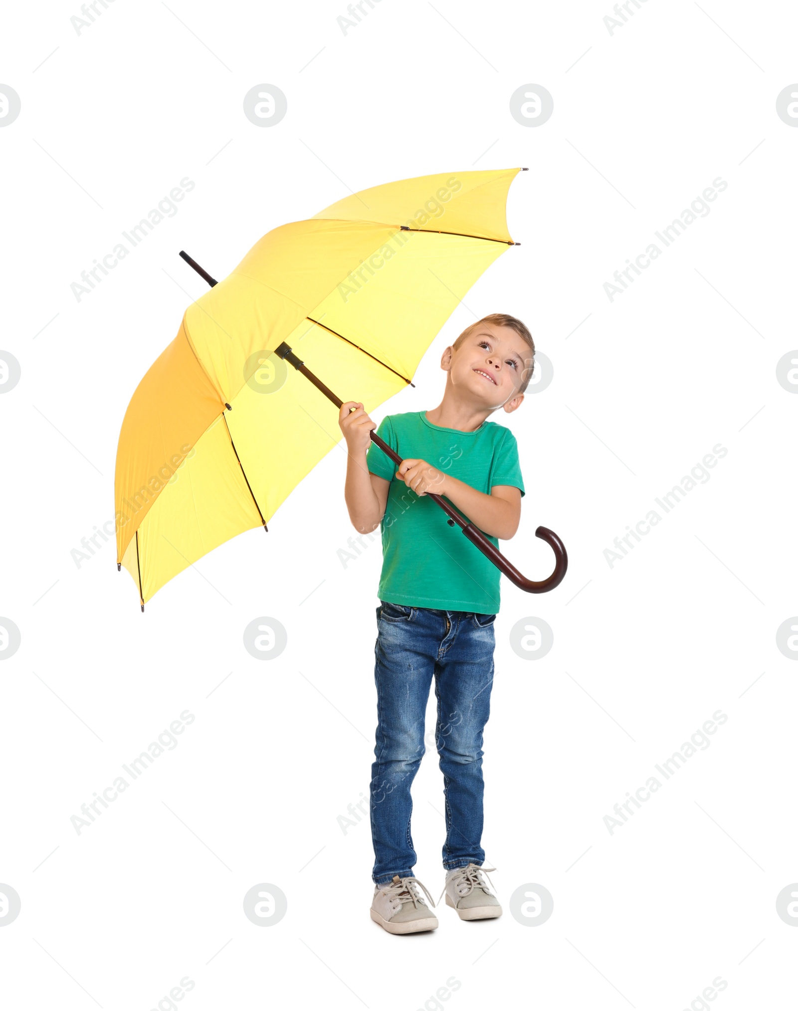 Photo of Little boy with yellow umbrella on white background